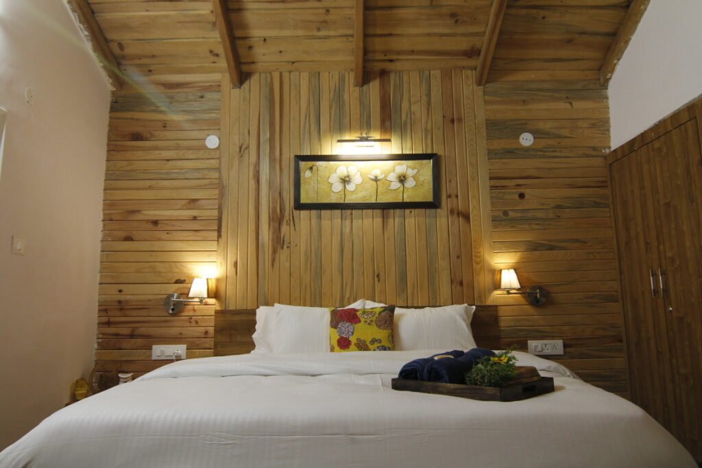Bedroom with pine panelling and warm lamps