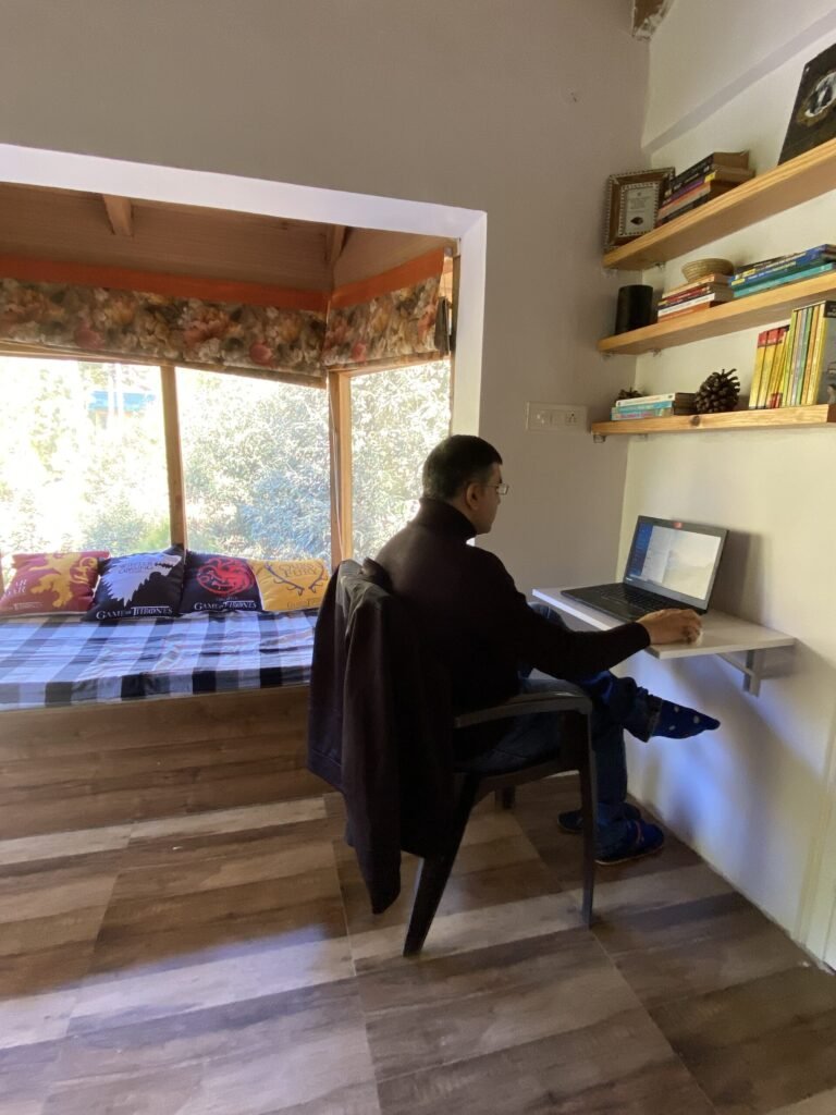 A guest reading on the garden wall